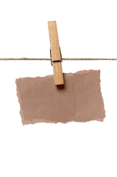 istock clothes peg and note paper on clothes line rope 516729430