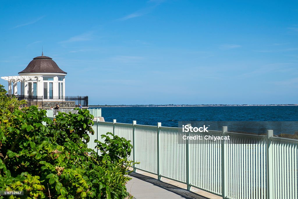 Gazebo by the Ocean White gazebo and a fence along oceanfront. Newport - Rhode Island Stock Photo