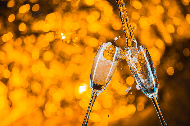 istock Glasses of champagne with splash 516755190