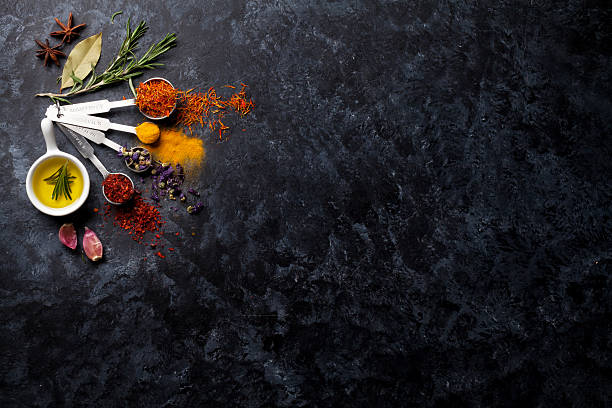 istock Herbs and spices over black stone 516755462