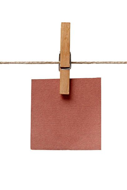 istock clothes peg and note paper on clothes line rope 516755580
