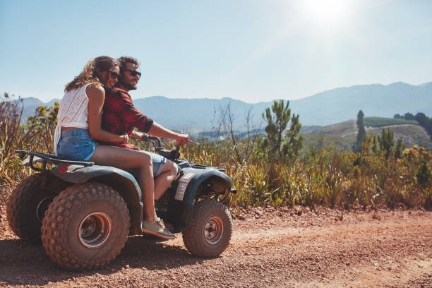 istock Couple in nature on a quad bike 516756090