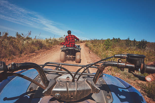 istock Man driving off road on an ATV 516756410