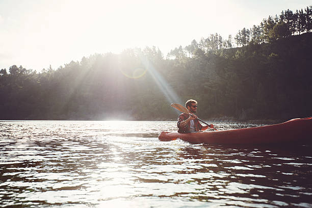 istock Man paddling kayak on a summer day 516756576