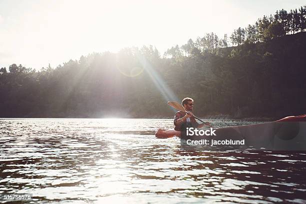 Man Paddling Kayak On A Summer Day Stock Photo - Download Image Now - Active Lifestyle, Activity, Adult