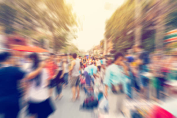 istock Blurred background. Blurred people walking through a city street 516756902