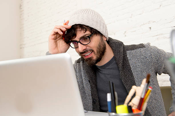 istock young hispanic hipster businessman working at computer home office 516758416