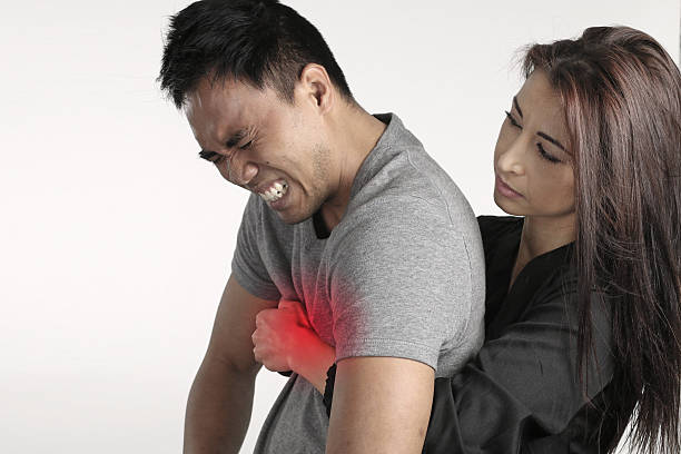 Young woman doing the first aid to a man