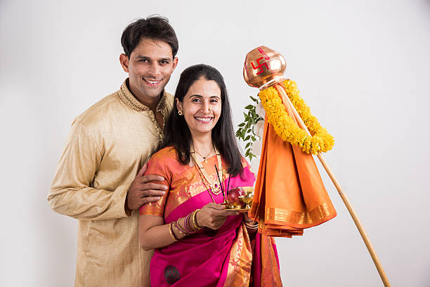 smart indian couple performing gudhi padwa puja