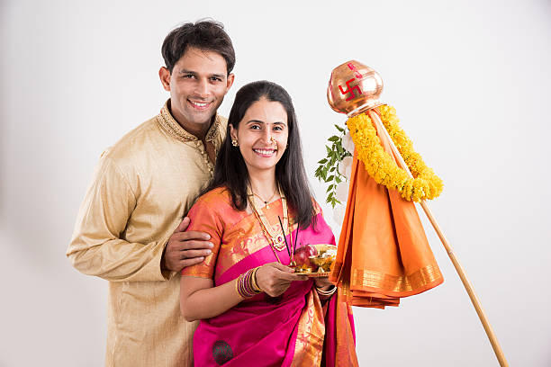 istock smart indian couple performing gudhi padwa puja 516762836