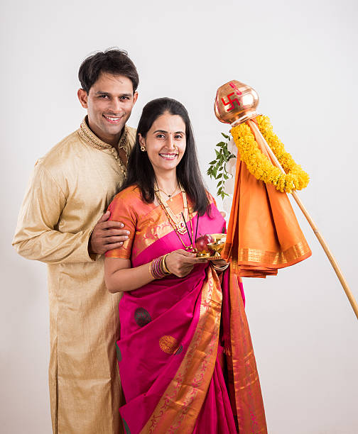 istock smart indian couple performing gudhi padwa puja 516763052