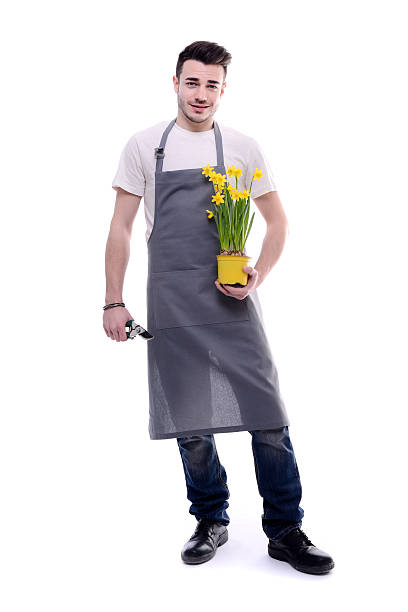 istock handsome young man gardener with flowers isolated on white background 516763434