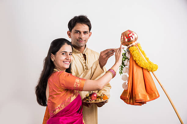 istock smart indian couple performing gudhi padwa puja 516763688