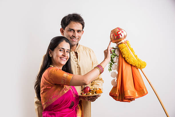 istock smart indian couple performing gudhi padwa puja 516763972