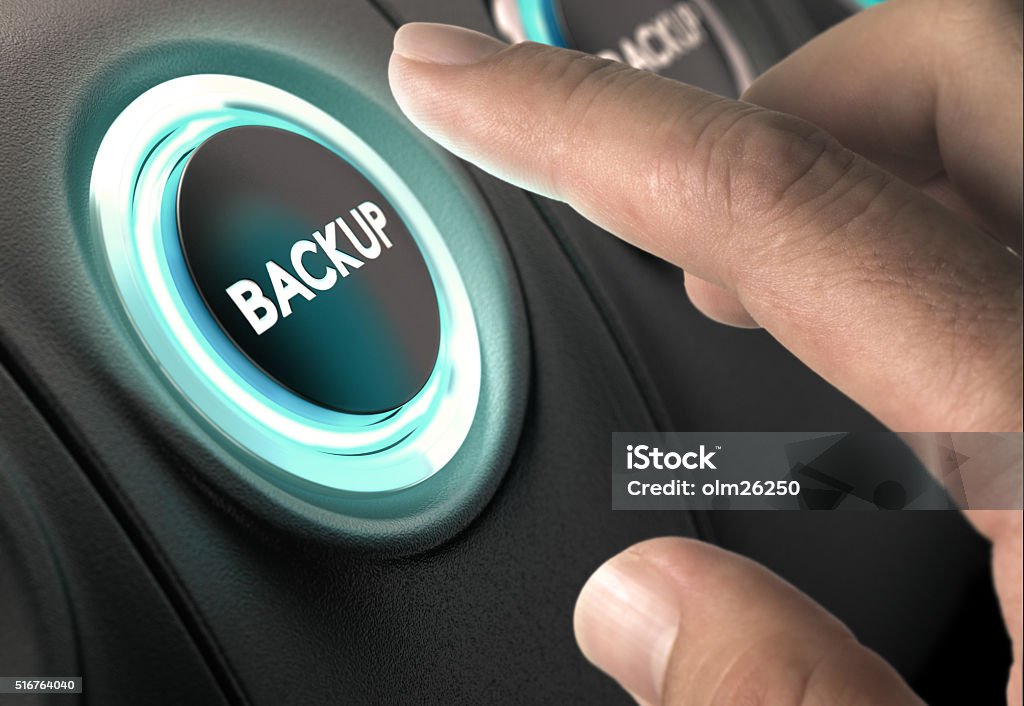 Data Backup, Security Concept Finger about to press circular button with blue light over black background. Concept of data backup and secure online back-up. Backup Stock Photo