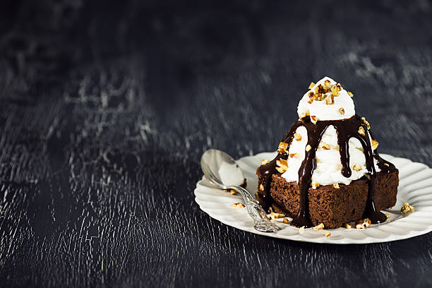 istock Brownie Sundae with Vanilla Ice Cream, Nuts, and Chocolate Sauce 516764320