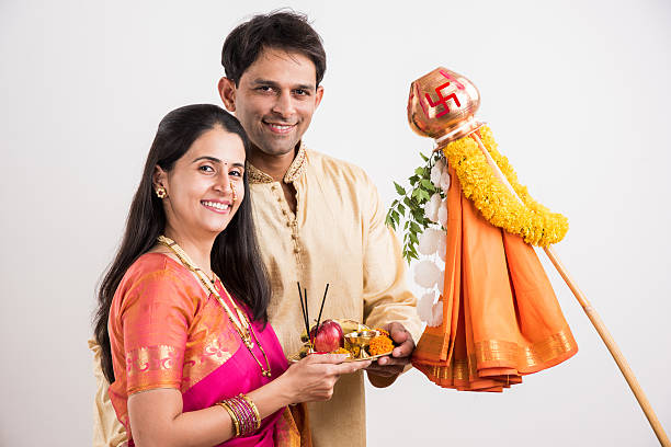 istock smart indian couple performing gudhi padwa puja 516764458