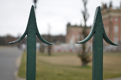 old metal fence at the park of sansscoui, potsdam, germany