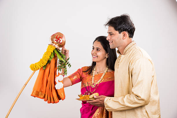 istock smart indian couple performing gudhi padwa puja 516765160