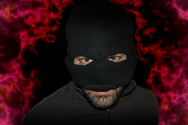 istock Man in mask andblack shirt. Balaclava 516765488