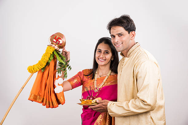 istock smart indian couple performing gudhi padwa puja 516765560