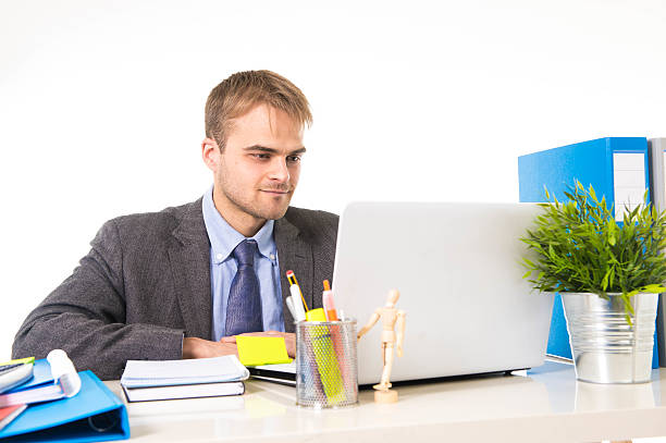 istock attractive businessman working busy with laptop computer at office desk 516765774