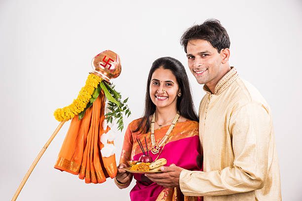 istock smart indian couple performing gudhi padwa puja 516765960