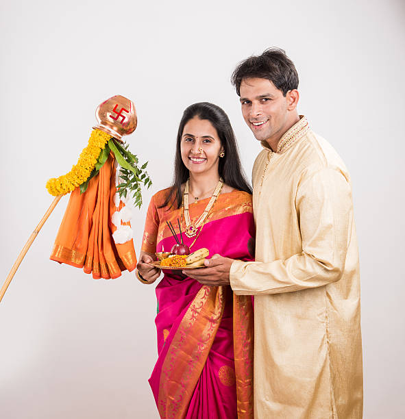 istock smart indian couple performing gudhi padwa puja 516766292