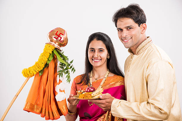 istock smart indian couple performing gudhi padwa puja 516766748