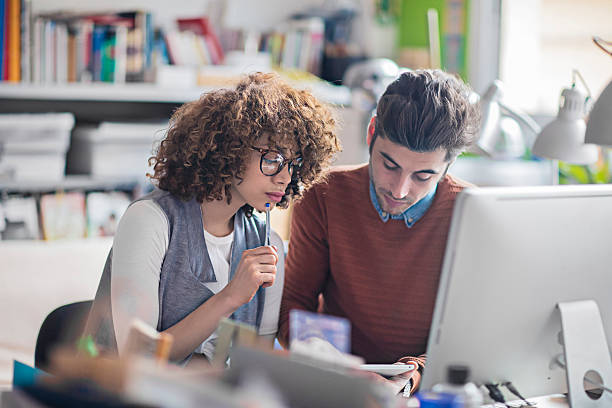 istock Two graphic designers working with digital tablet in the office 516767000