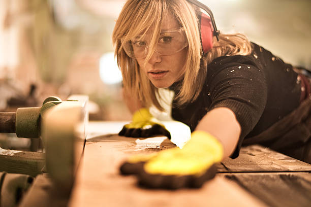 istock Blonde woman working with plank 516767760