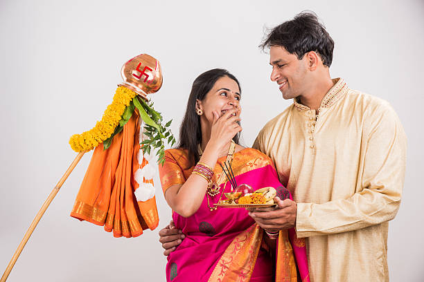 istock smart indian couple performing gudhi padwa puja 516767810