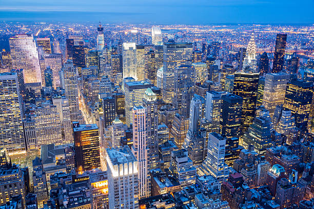 New York City Skyline, Manhattan, Aerial View at Night Midtown Manhattan skyline, New York City, illuminated buildings at night, elevated view, horizontal, long exposure with tripod, USA midtown manhattan photos stock pictures, royalty-free photos & images