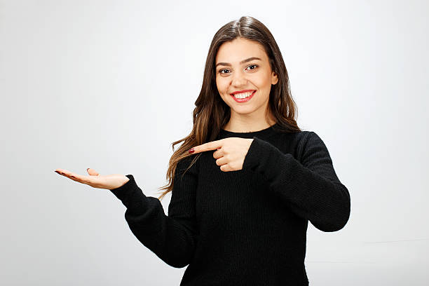 Young woman showing your product