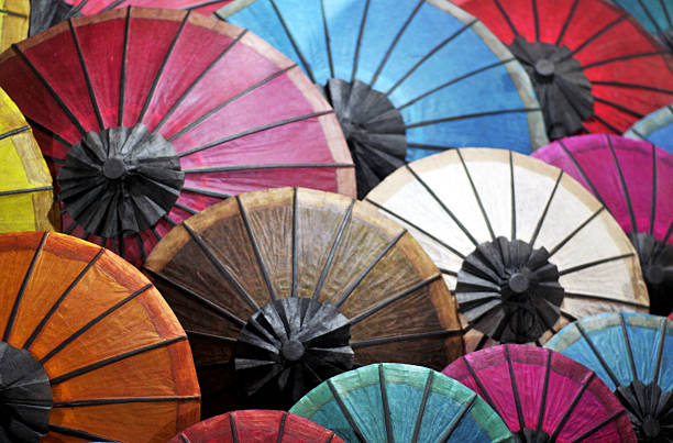 beautiful paper umbrellas at a market stock photo
