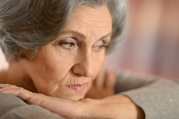 istock Sad senior woman 516770492