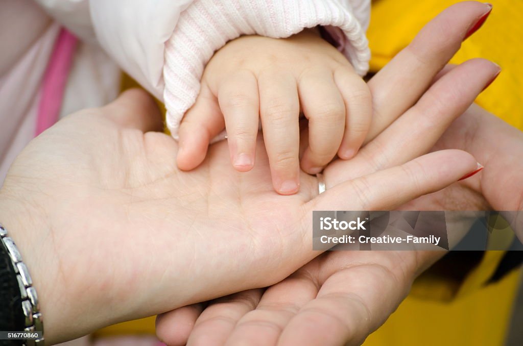 father's mother's and baby's hand father's mother's and baby's hand holding each other Family Stock Photo