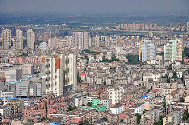 Shenyang City Skyline, Liaoning, China Aerial view of Modern Apartment buildings in downtown of Shenyang, Liaoning Province, China. Shenyang is the largest city in Northeast China (Manchuria). Photo taken from the top of Liaoning Broadcast and TV Tower, downtown Shenyang, China. shenyang stock pictures, royalty-free photos & images