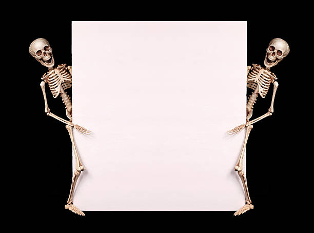 Skeletons holding empty blank over black. Halloween