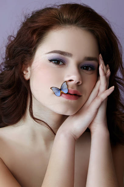 istock Girl with butterfly. 516790310