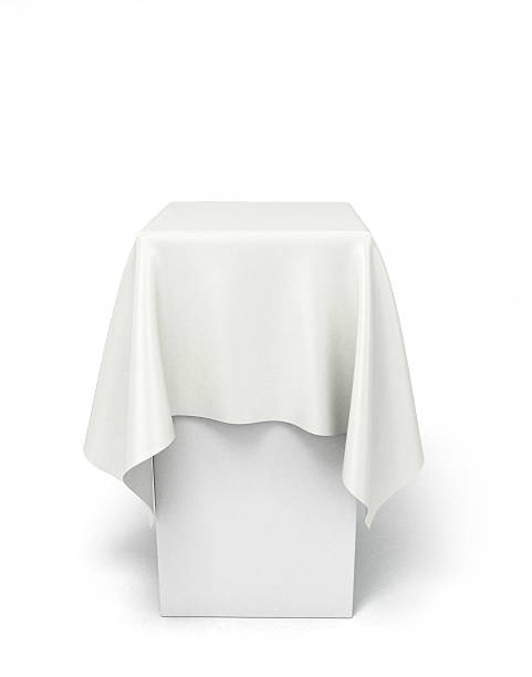 istock white cloth on a square pedestal isolated on white 516794098