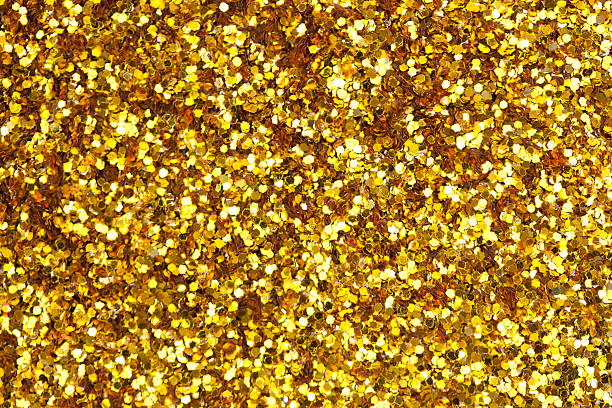 istock Close up a fine shining gold glitter 516795494