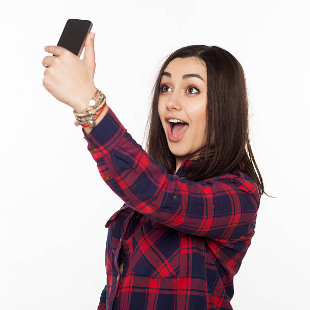 istock cute woman making selfie photo 516796030