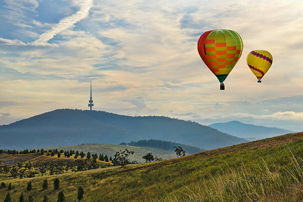 Canberra, Hot Air Balloon, Australia, multicolour, hills,  Dawn, Telstra Tower Canberra, Australia, 13 March 2016. Canberra, Hot Air Balloon, Australia, multicolour, hills,  Dawn, Telstra Tower canberra stock pictures, royalty-free photos & images