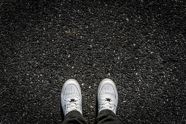 istock Sports Shoes on Asphalt 516799208