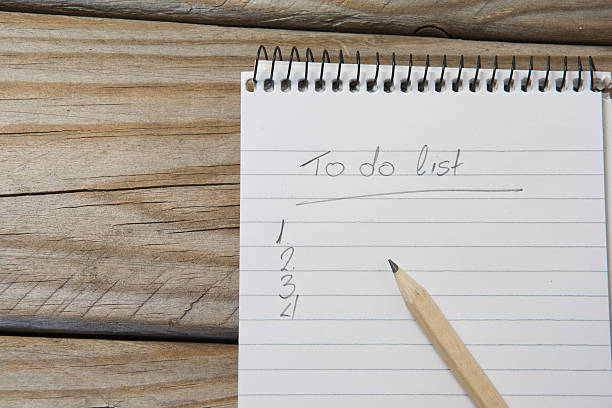 istock notepad with pencil on a wooden table 516800098