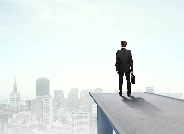 istock businessman standing on pier 516801406