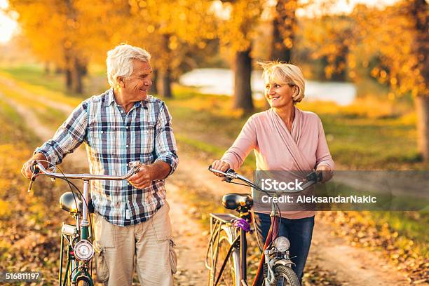 Active Senior Couple Stock Photo - Download Image Now - Autumn, Mature Couple, Senior Couple