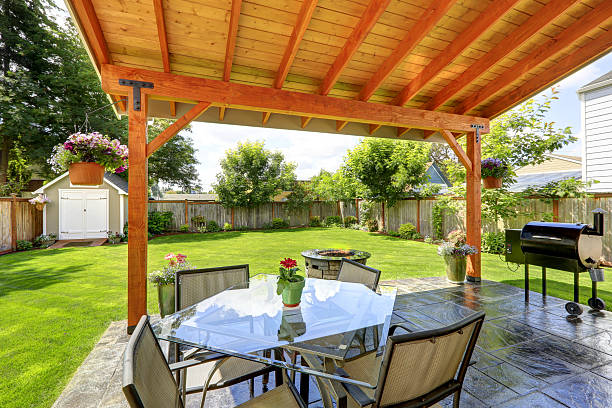 istock Patio set with glass top table and chairs 516811279