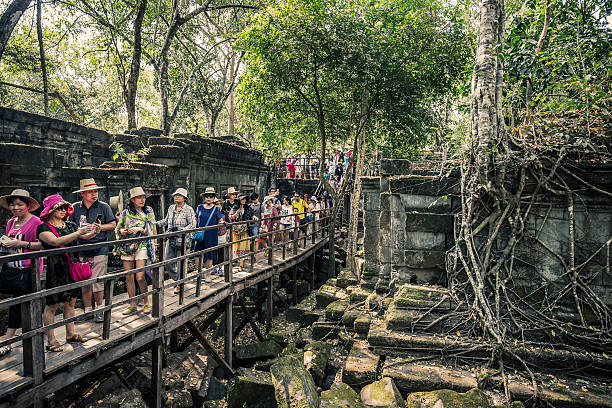 Siem Reap, Cambodia - February 24, 2016: People visiting the Beng Mealea ruins, a temple complex of the Angkor Wat period in Cambodia. Of Hindu origin its origin is not sure although experts belief it was built during the reign of king Suryavarman II in the early 12th century. It is one of the largest temples of the region although much of it is very deteriorated.
